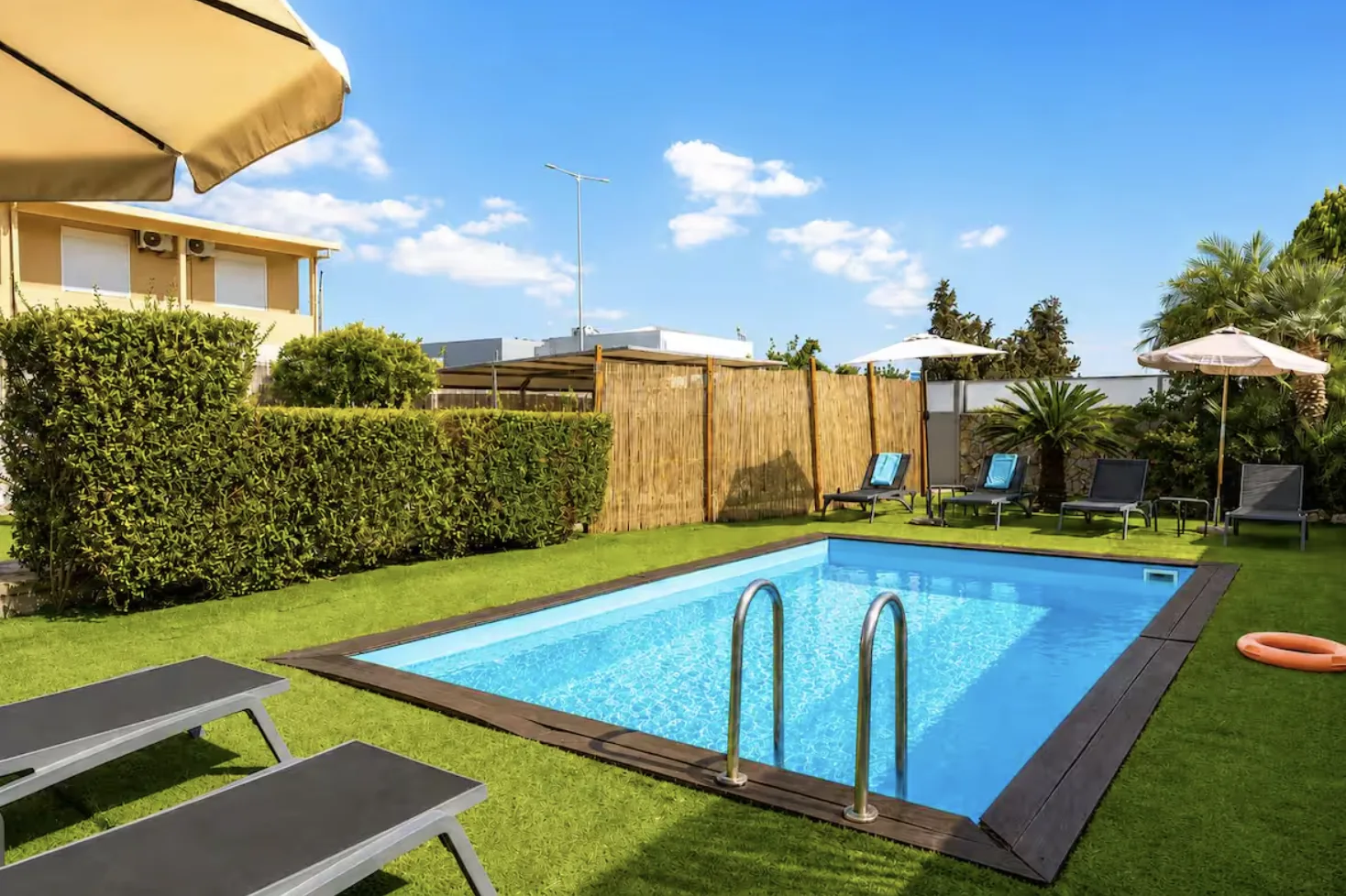Private swimming pool and sun loungers in the garden of Villa Morea, Chania, Crete