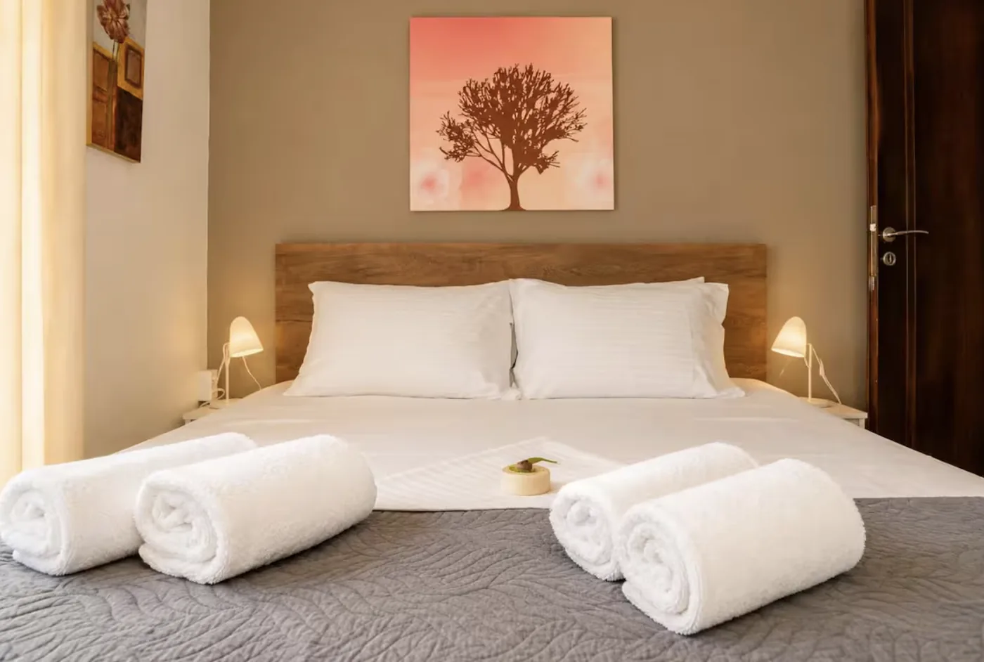 Bedroom 1 with queen bed and wooden headboard at Villa Morea